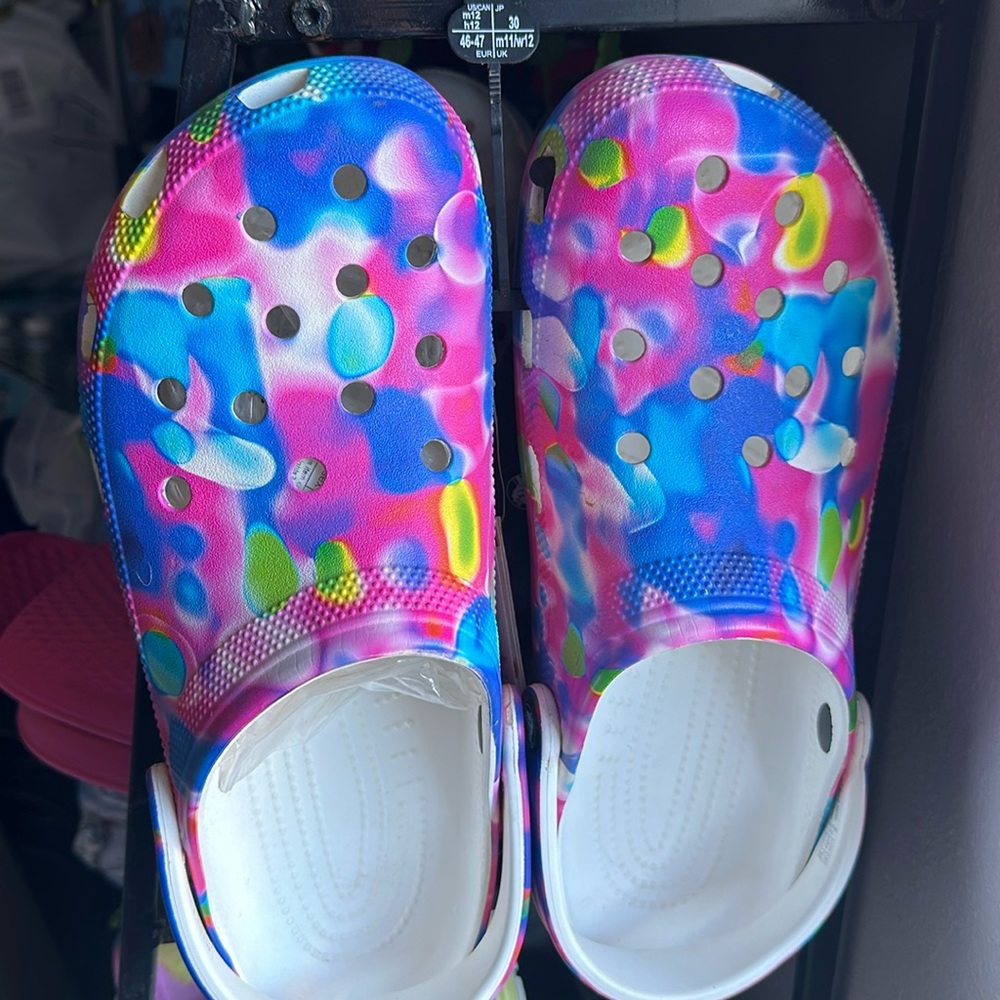 - Pink blue and yellow low splattered crocs size 12